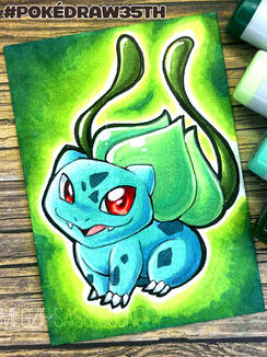 A photo of an ACEO marker drawing of a Bulbasaur. The background is a green vignette. The photo is taken on top of scrapbooking paper with a wood texture. A few markers visible at the side of the photo. Drawn for the PokéDraw35th project. ©Megzie Sass-Coun